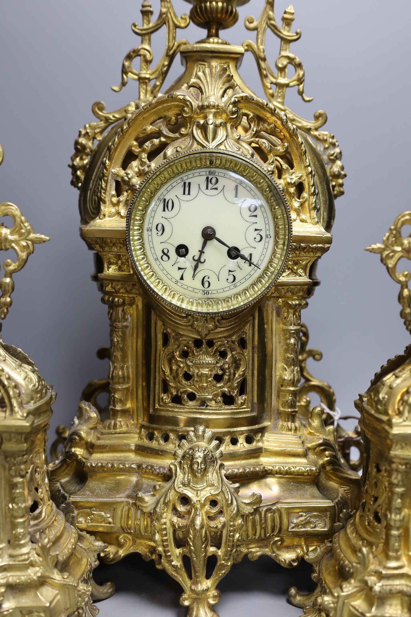 A large decorative French gilded bronze 19th century clock garniture - 56cm tall